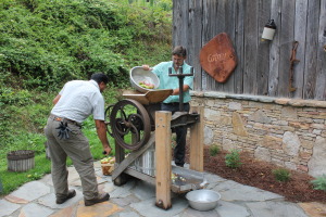 Grind and press apple juice into delicious cider. Manual labor of love!