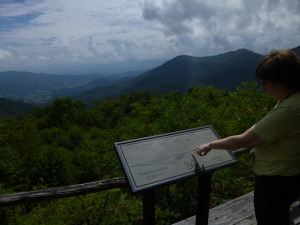 Barb looks over a map of some of the Smoky Mountain Range. 
