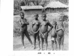 Pygmy women and girls in the Ituri Rain Forest in the Congo. A few miles from where we first saw a very wild  gorilla. We stayed and broke "bread" (roast snake) with some members of a family group of Pygmies. I hunted with them too (see story in my book: "Africa on a Pin & a Prayer)."