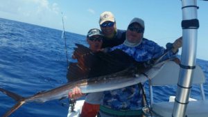 Brian Epstein holds his friends sailfish. Brian (related to long gone Beatles Manager) is as effective in finding fish as his namesake was in finding great Worldwide Talent!!